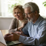 Couple doing research on estate planning firms